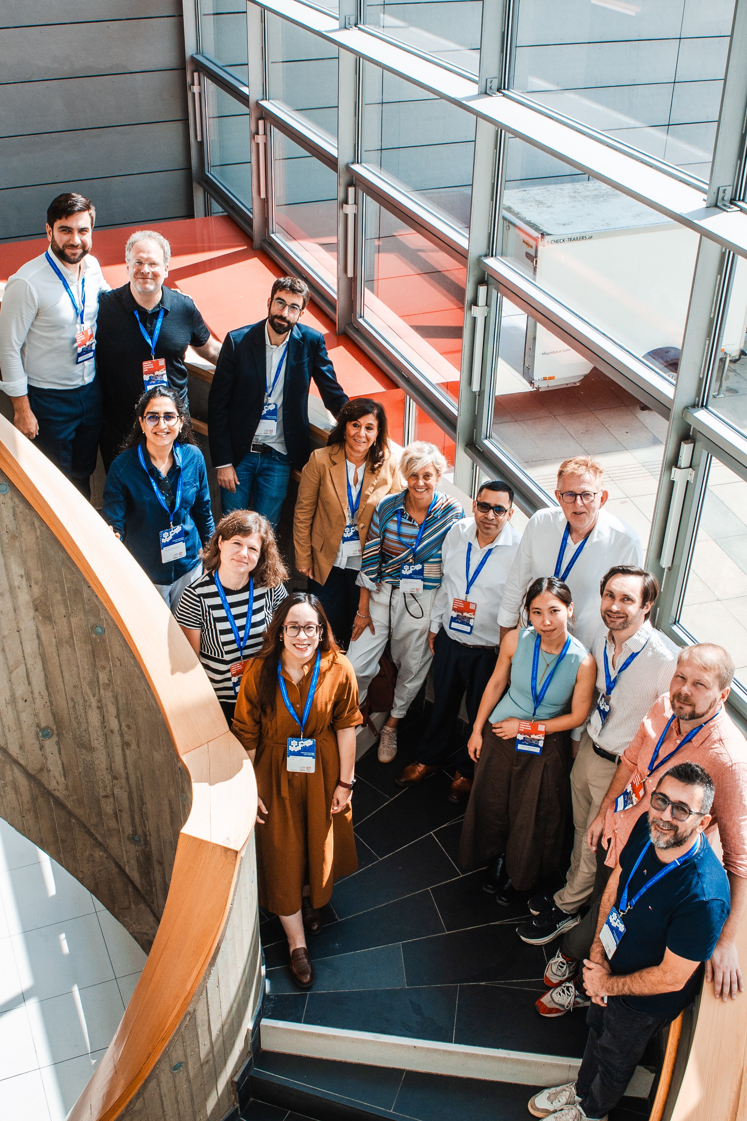 H2CoVE, H2Excellence, and H2VE project teams posing together on the stairs of the Forum workshop building in Graz