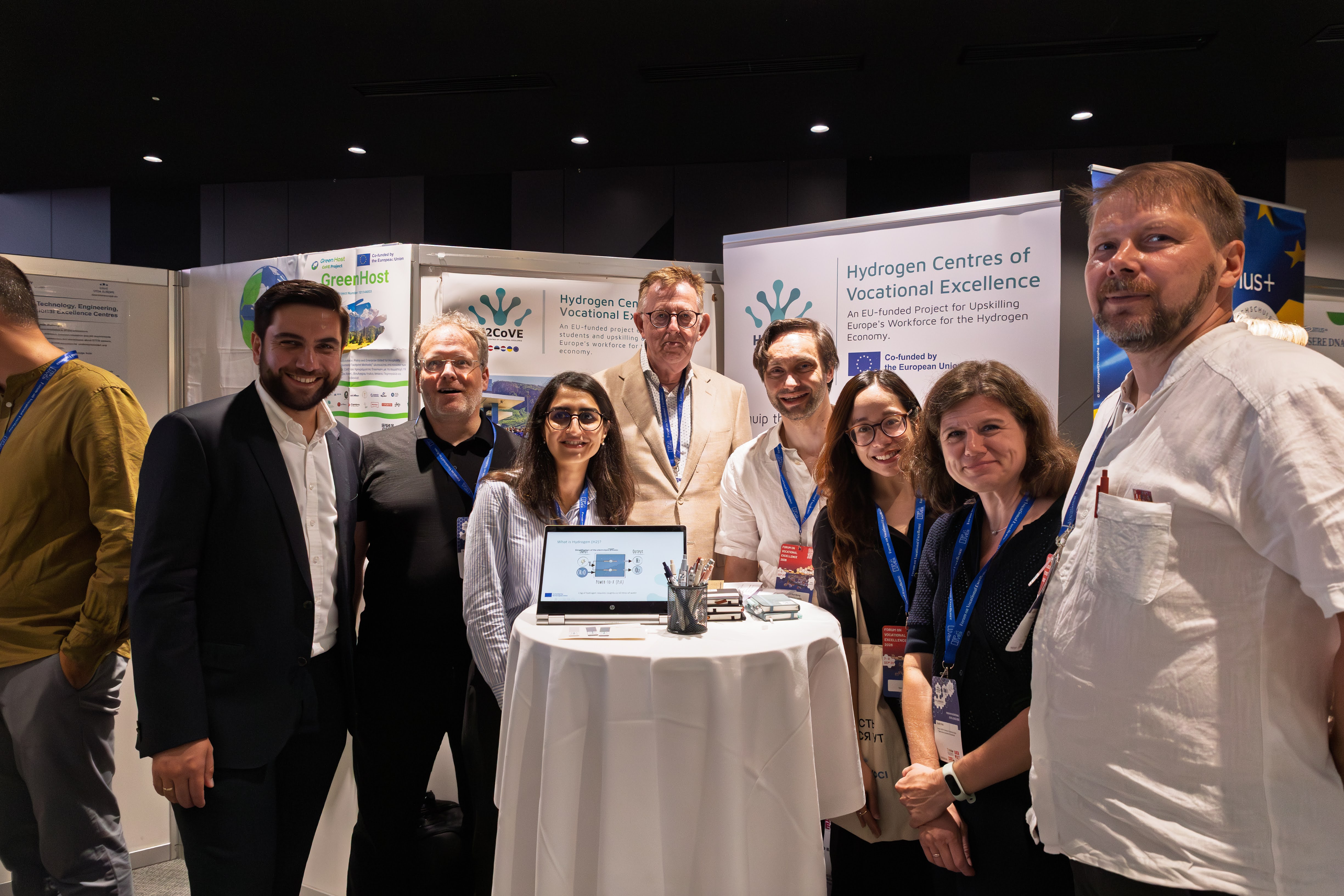 A group photo of the H2CoVE Team at the booth exhibition