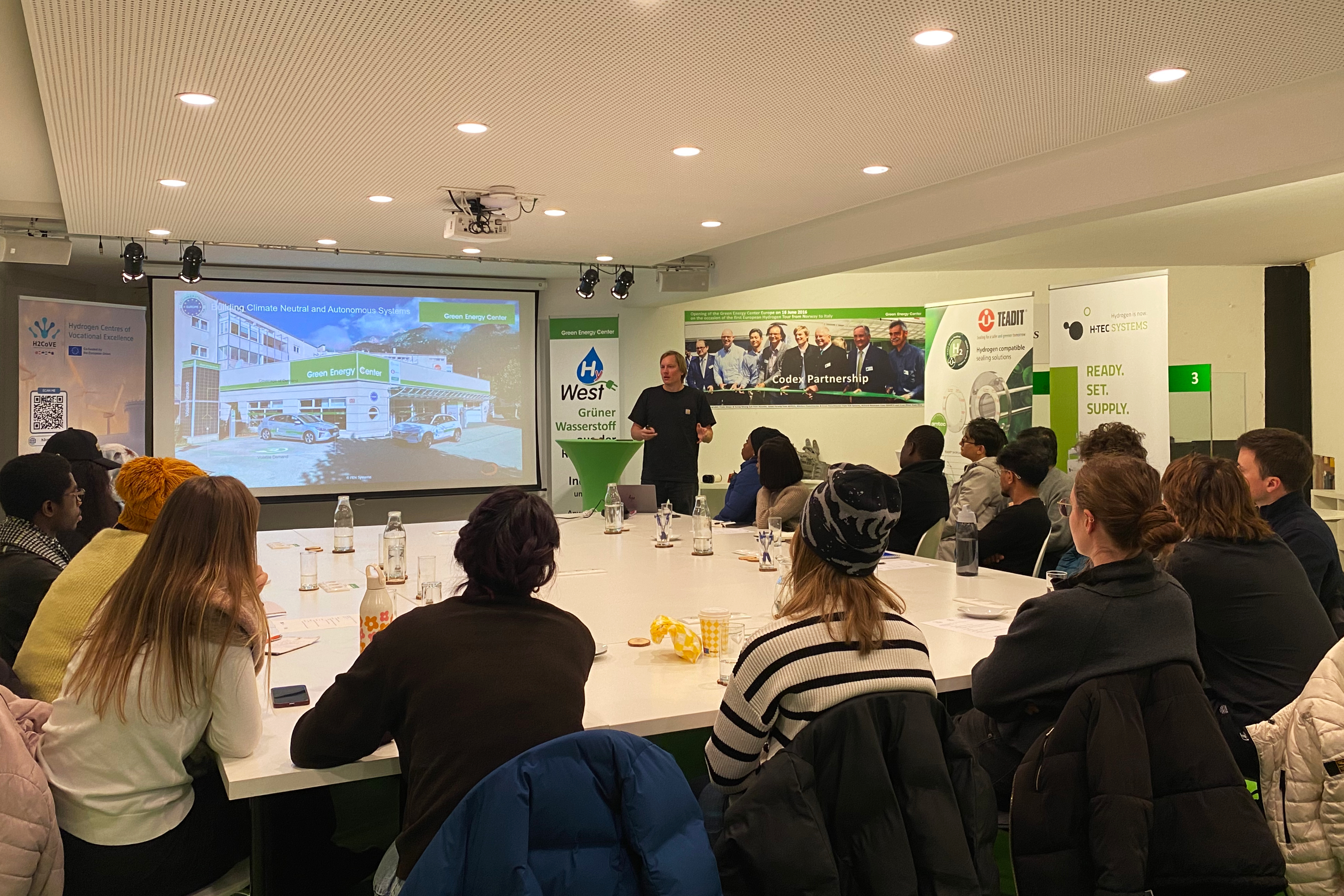 Students seated in a conference room listening to a lecture by Nicolas Fleischhacker